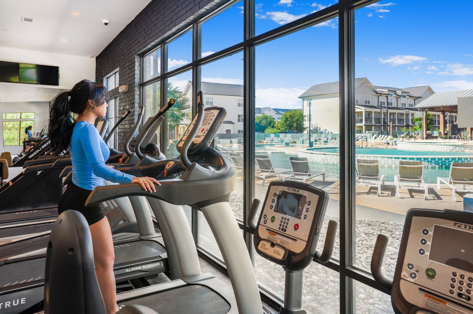 Woman on treadmill looking out the window