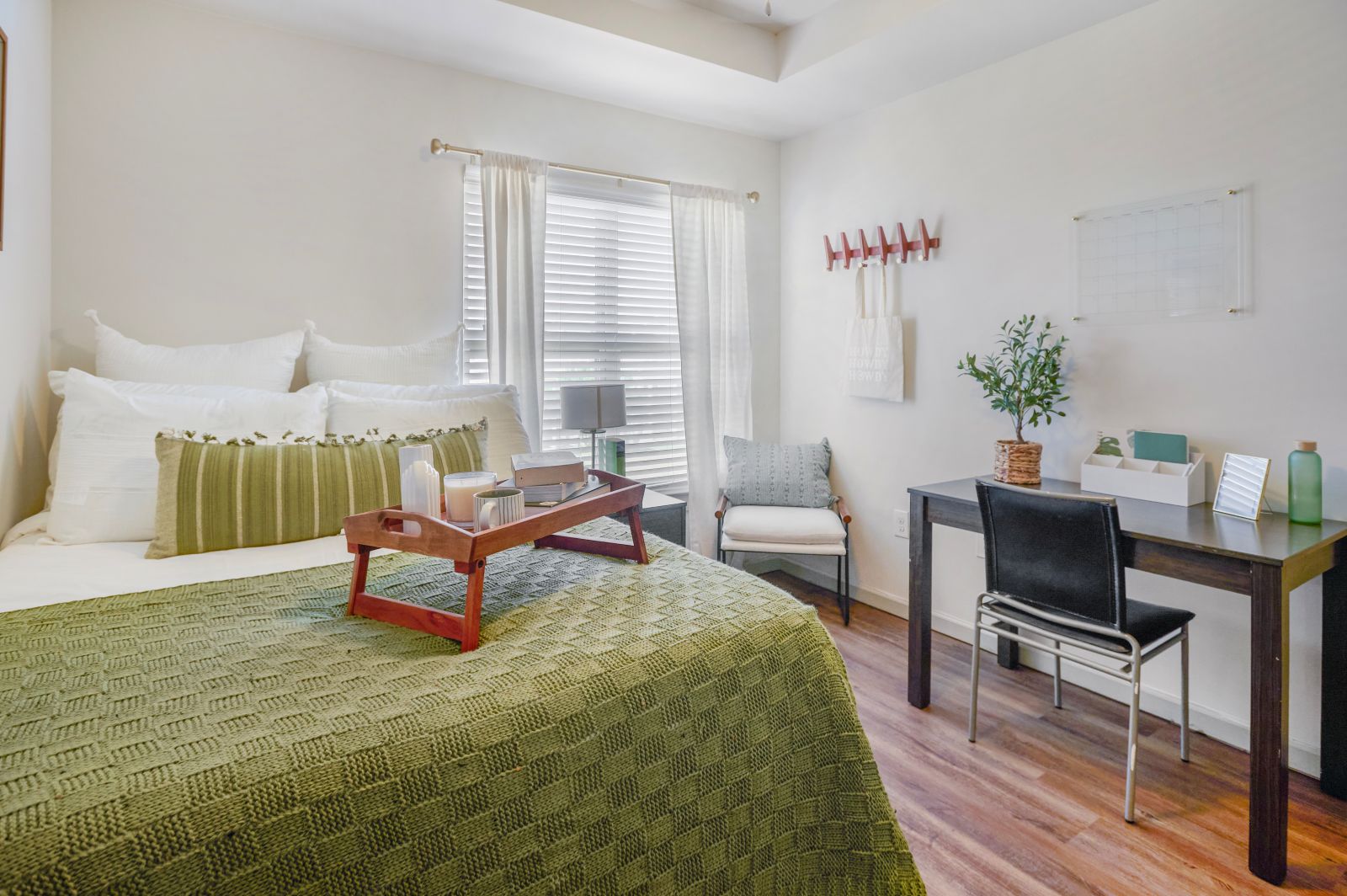 Close up of green blanket and tray in bedroom