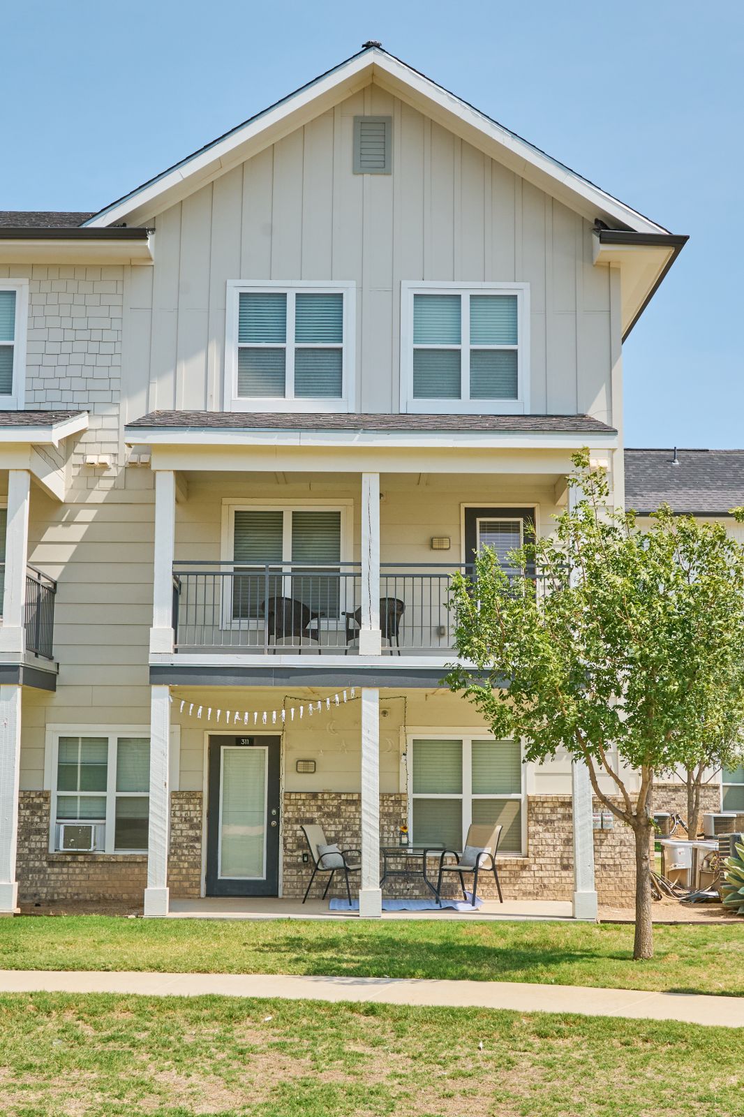 Exterior of light colored townhouse