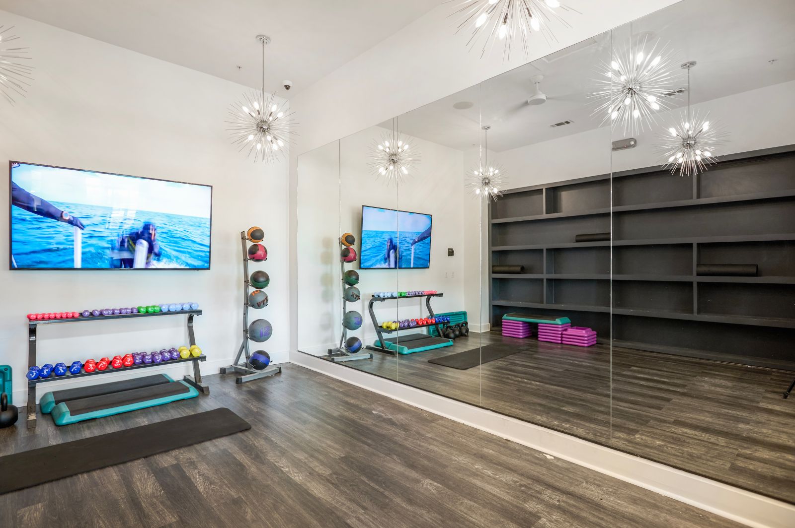 Indoor gym with mirror and hand weights