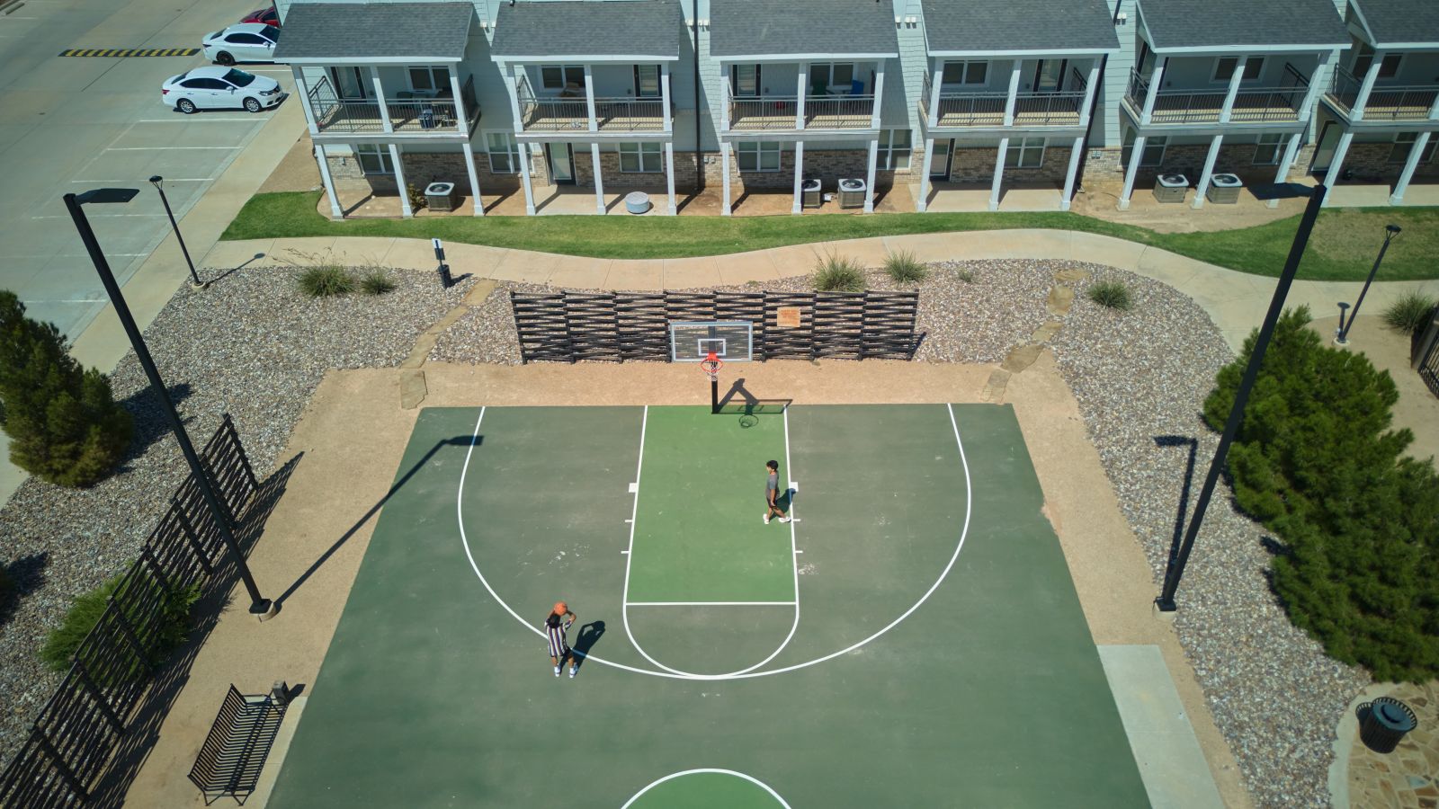 Overhead view of three boys playing basketball